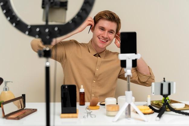 Front view man recording himself